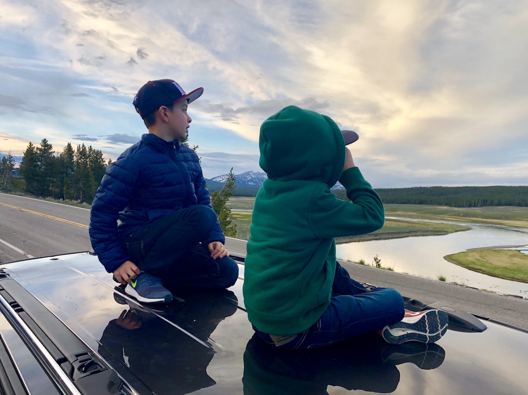 on top of the car watching for wolves