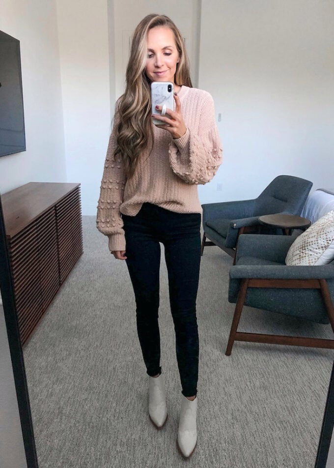 black jeans, puffed sleeve sweater, white boots