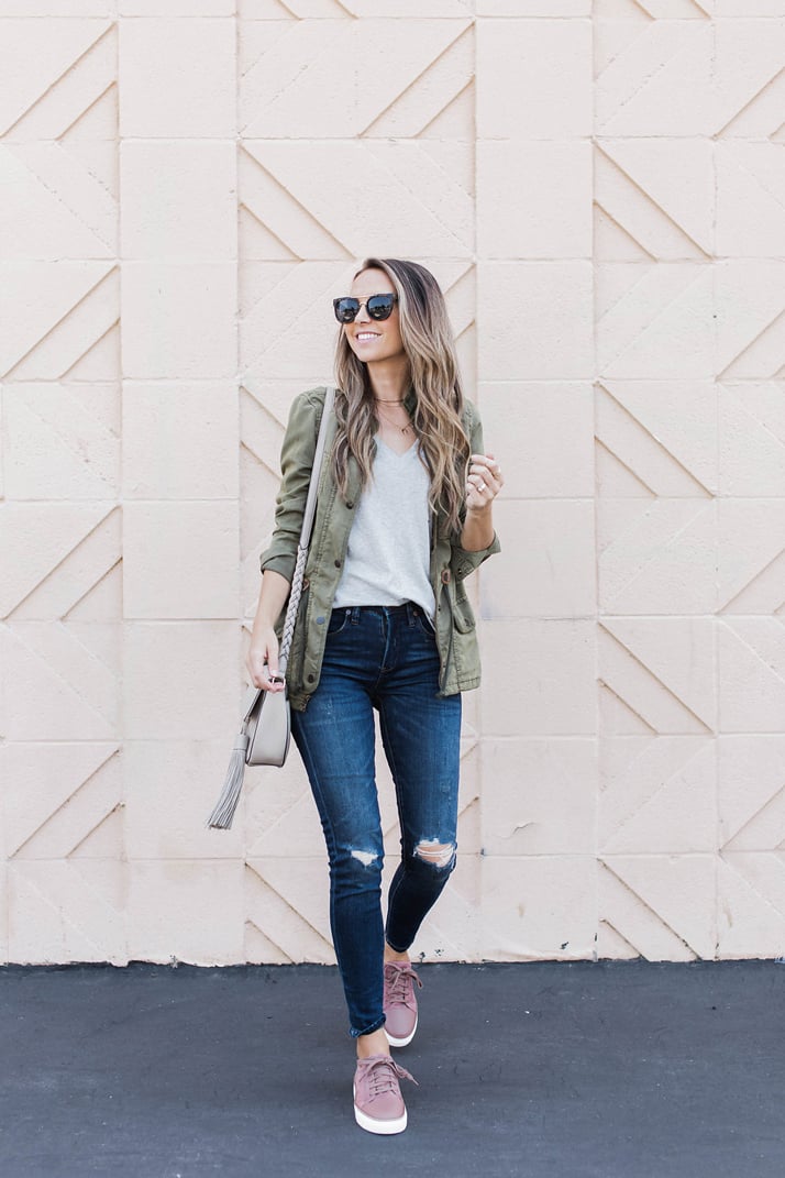 Olive utility jacket and gray t-shirt and jeans