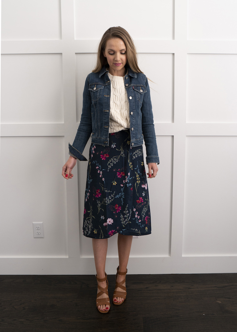 cable knit sweater with floral dress and denim jacket