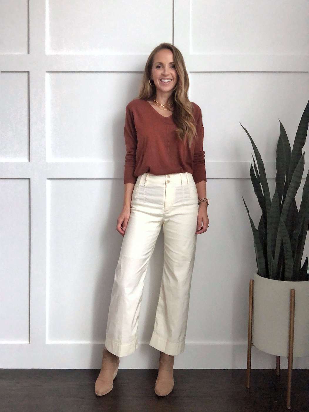 Winter whites outfit: wide leg pants with rust sweater